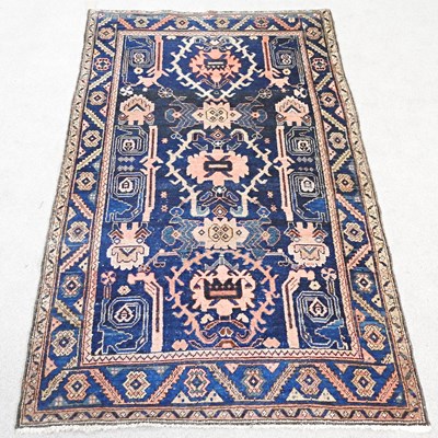 Lot 400 - A Caucasian rug, with hooked medallions, on a...