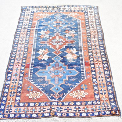 Lot 682 - A Caucasian rug, with geometric designs,...