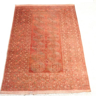 Lot 390 - An Afghan rug, with two rows of medallions, on...