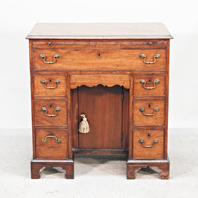 Lot 107 - A George III mahogany kneehole desk, of small...