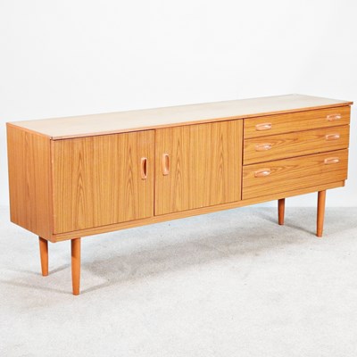 Lot 127 - A mid 20th century laminated sideboard, on...