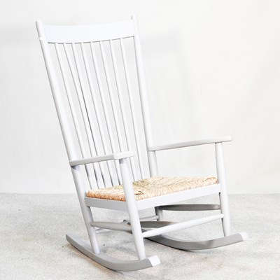 Lot 121 - A painted wooden rocking chair, in the manner...