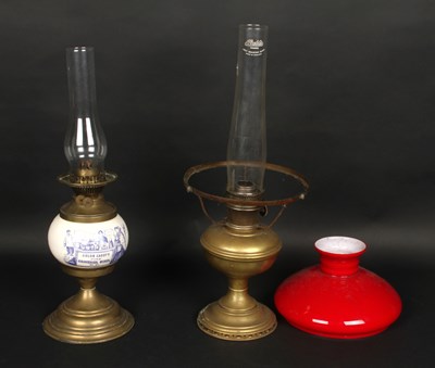 Lot 509 - An advertising brass oil lamp, with ceramic...