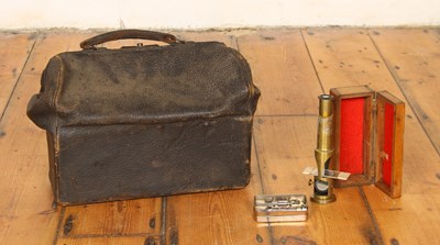 Lot 638 - A vintage leather doctor's Gladstone bag, and...