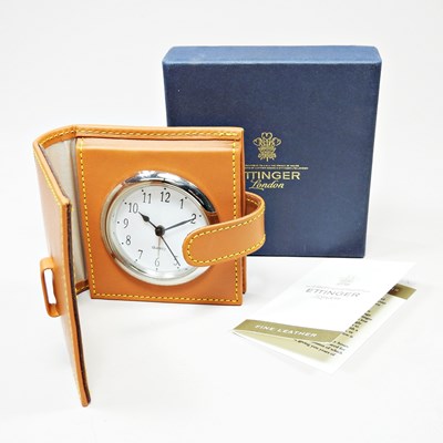 Lot 616 - An Ettinger leather cased travel clock, boxed