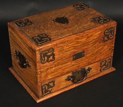 Lot 460 - An early 20th Century oak and brass mounted...