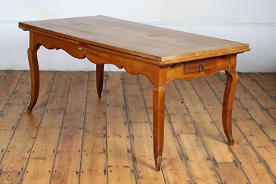 Lot 563 - An antique continental fruitwood extending...