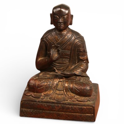 Lot 213 - A Chinese bronze figure of a deity, shown in...