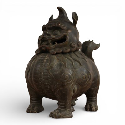 Lot 217 - A Chinese bronze censer, in the form of a dog...