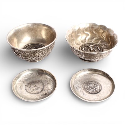 Lot 61 - Two Chinese white metal bowls, together with...