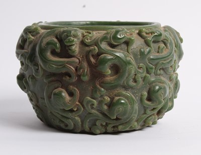 Lot 297 - A Chinese carved green hardstone bowl