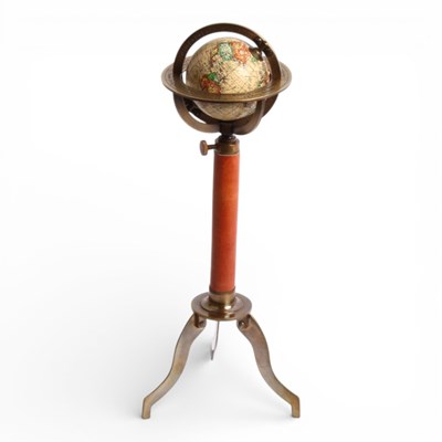Lot 104 - A miniature desk terrestrial globe, on a brass...