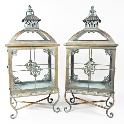 Lot 461 - A pair of copper lanterns, on stands, each...