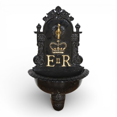 Lot 209 - A black painted cast metal wall fountain,...