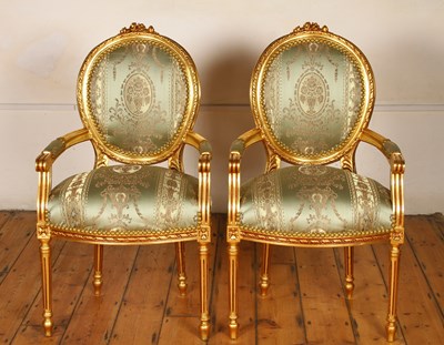 Lot 453A - A pair of carved gilt wood and green silk...