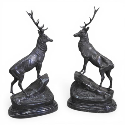 Lot 73 - After Moignieu, 20th century, a pair of stags,...
