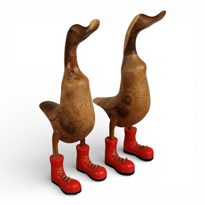 Lot 552 - A pair of carved wood models of ducks in boots