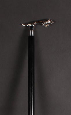 Lot 764 - An ebonised walking stick, having a metal...
