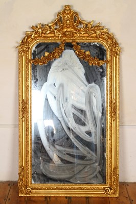 Lot 591 - A neoclassical style gilt wood wall mirror,...