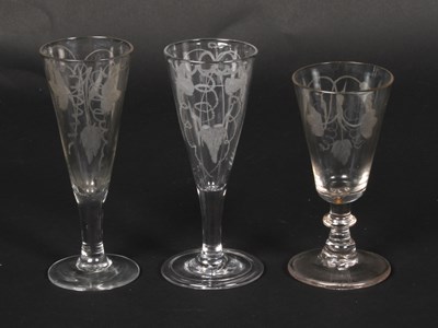 Lot 32 - Three 18th century glass ale glasses, etched...