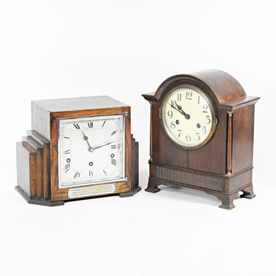 Lot 205 - An Art Deco oak cased mantel clock, with a...