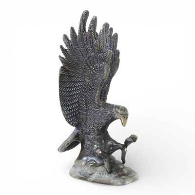 Lot 218 - A modern bronzed model of an eagle