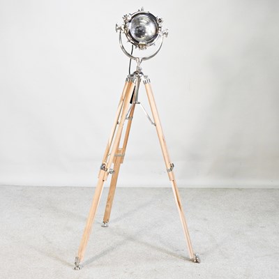 Lot 569 - A floor standing spotlight lamp, on a teak...