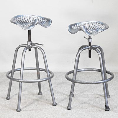 Lot 227 - A pair of metal tractor seat revolving bar...