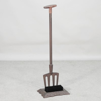 Lot 420 - A novelty bootscraper, in the form of a garden...