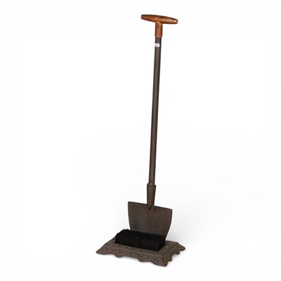 Lot 524 - A metal bootscraper and brush, in the form of...