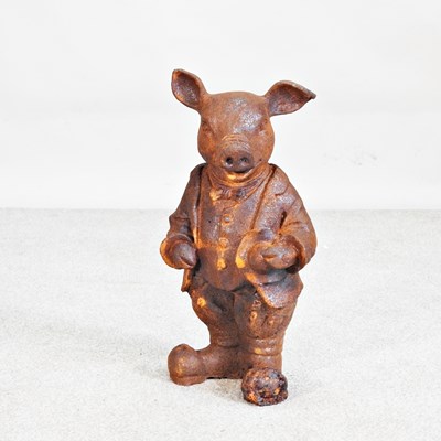 Lot 281 - A rusted metal garden statue of Mr Pig, 45cm high