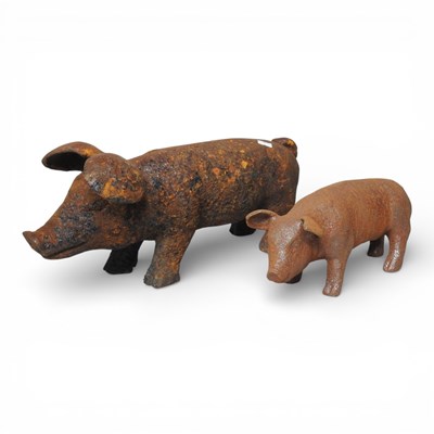 Lot 648 - Two rusted metal models of pigs, largest 44cm,...