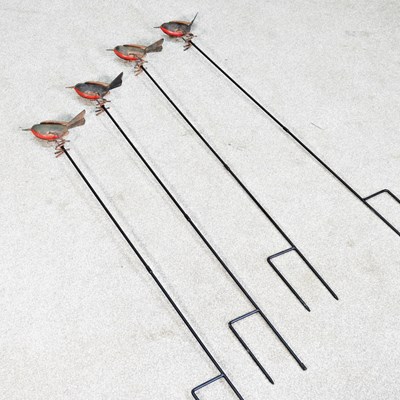 Lot 594 - A set of four painted metal robin garden plant...