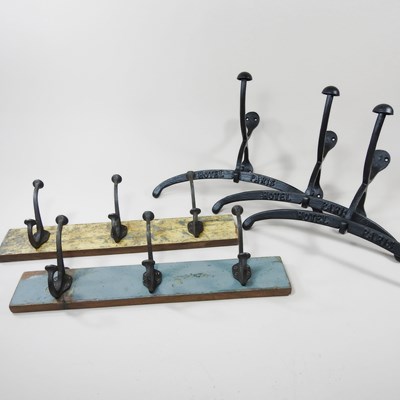 Lot 638 - A pair of painted wooden coat racks, each 46cm...