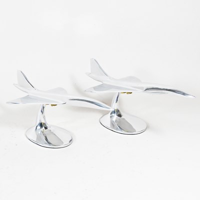 Lot 377 - A pair of polished aluminium desk models of...