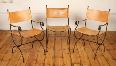 Lot 551 - Three leather and wrought iron chairs,...