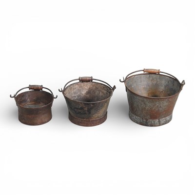 Lot 589 - A set of three graduated metal buckets, with...