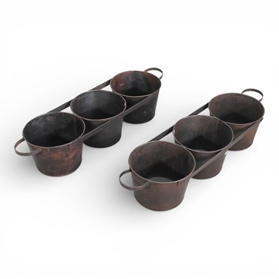 Lot 558 - A pair of metal triple garden planters (2)