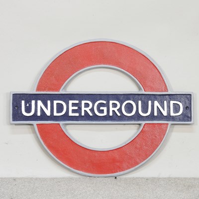 Lot 593 - A cast metal London Underground sign, 59cm wide
