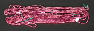 Lot 47 - A collection of ruby single strand rough cut...
