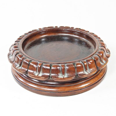 Lot 370 - A 19th century Chinese carved hardwood stand,...