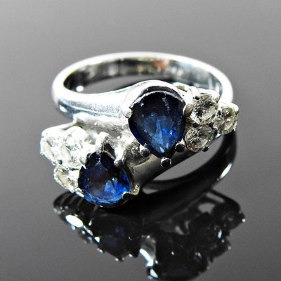 Lot 13 - An 18 carat gold white gold sapphire and...