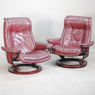 Lot 242 - A pair of Ekornes Stressless red leather...