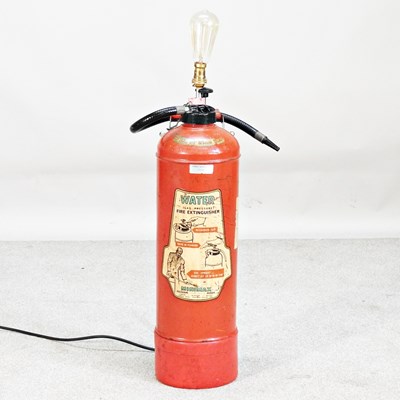 Lot 286 - A standard lamp in the form of a fire...