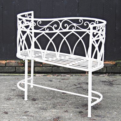 Lot 596 - A white metal garden love seat