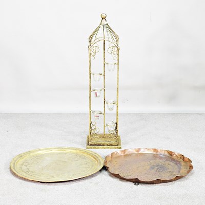 Lot 634 - A brass candle holder, 94cm high, together...