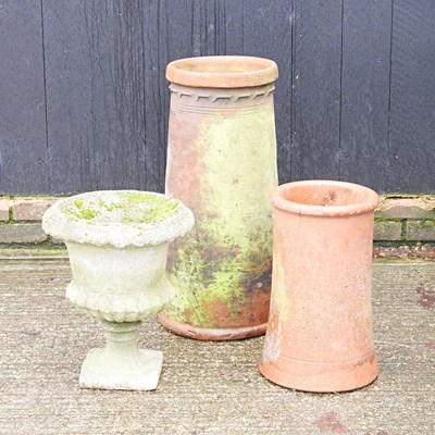 Lot 493 - A cast stone garden urn, together with a...