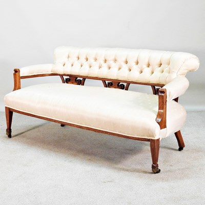 Lot 130 - An Edwardian cream upholstered button back two...