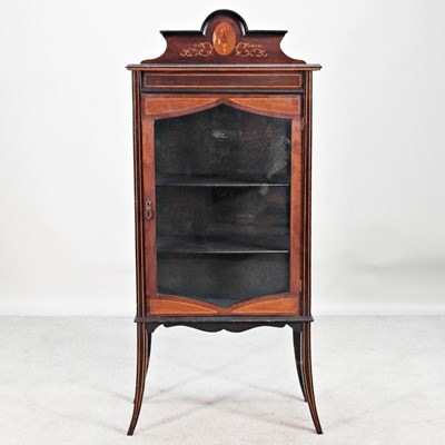Lot 509 - An Edwardian inlaid display cabinet, on swept...