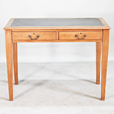 Lot 143 - A mid 20th century writing table, on square legs